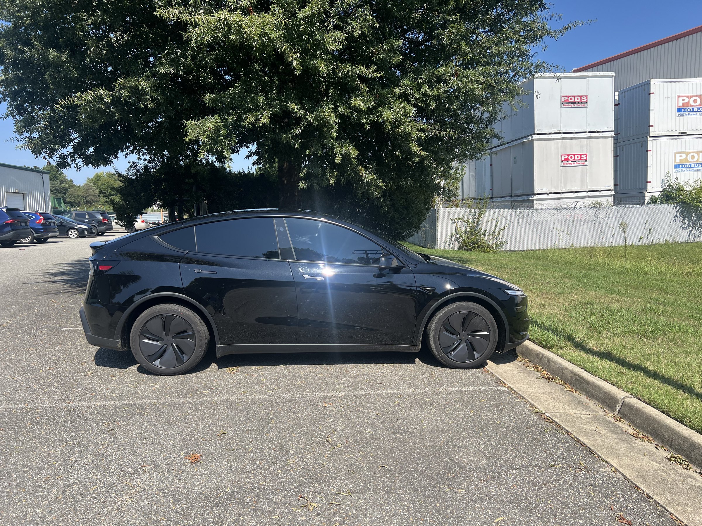 Black Tesla Model Y with professionally installed automotive window tint