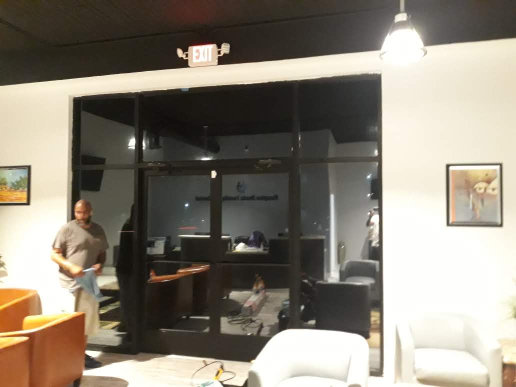 Dark privacy film installed on interior commercial office glass