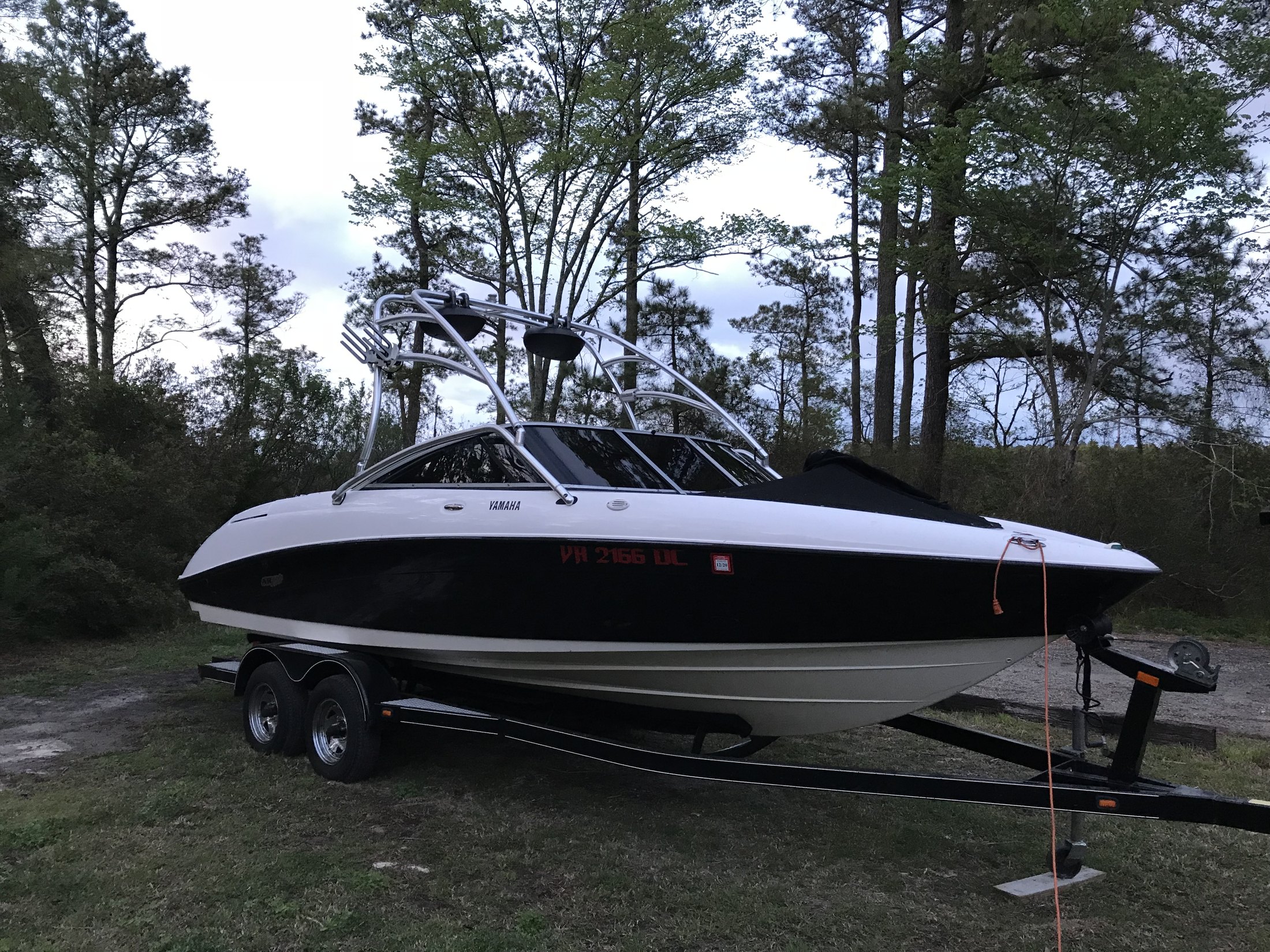 Finished dark marine window tint on a black and white Yamaha wake boat