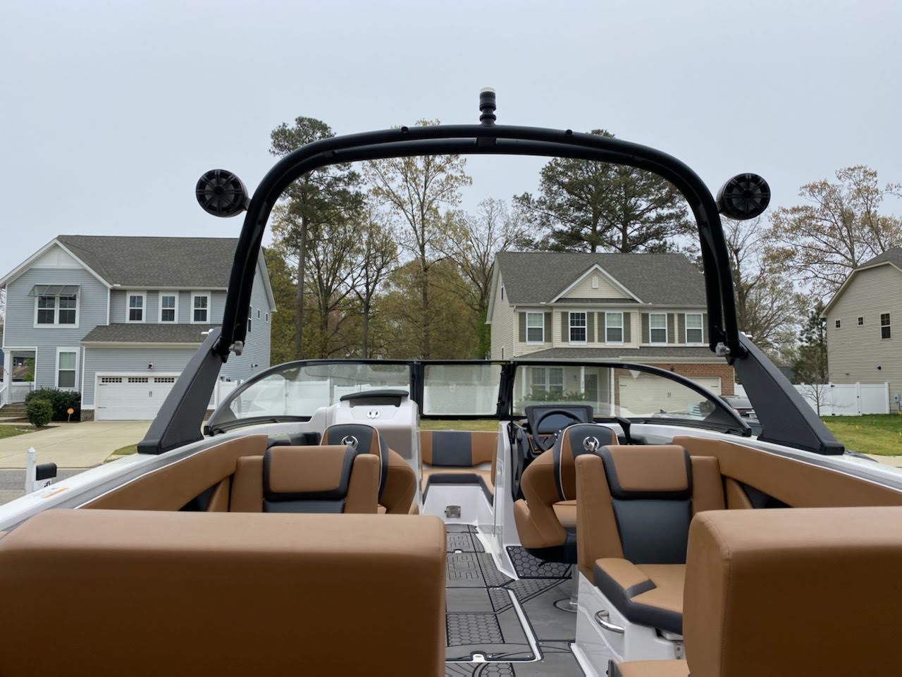 View from inside a wake boat through its tinted windshield