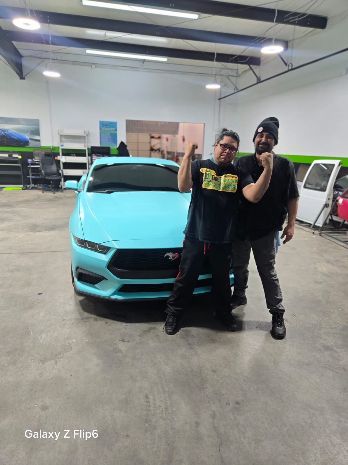 Tint Heaven team with the completed mint wrapped Mustang